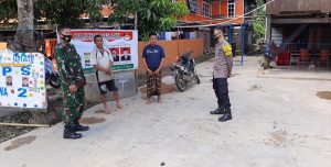 Jelang Pilkades Serentak, Bhabinkamtibmas Polsek Tanasitolo Bersama Babinsa Desa Lowa Lakukan Patroli